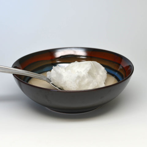 Raw Coconut Oil on a spoon
